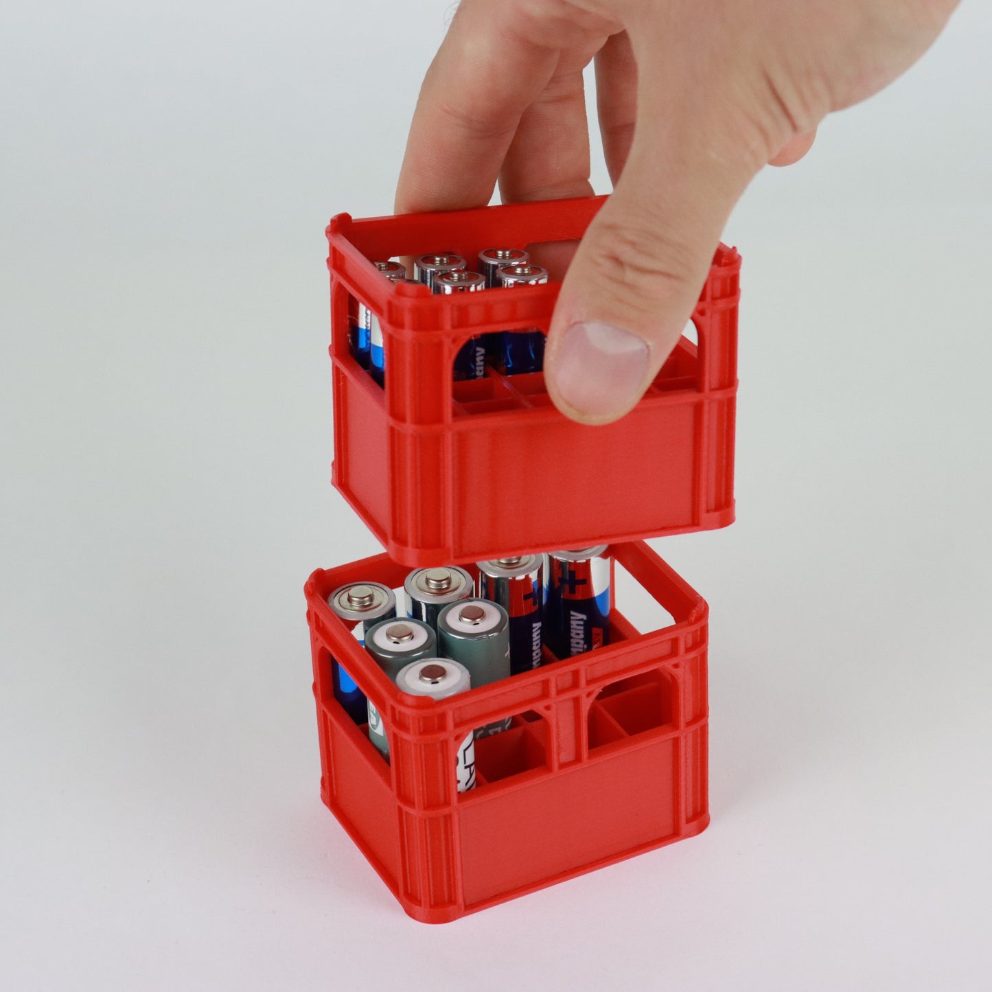 Staplingsbara ölbackar i miniatyr för AA och AAA batterier